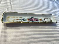 Top view showing floral design and gold trim