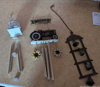 All three wind chimes laid out side by side