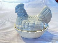 Front view of ceramic hen-on-nest covered dish assembled