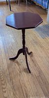 Full view of octagonal accent table showing top, pedestal, and legs
