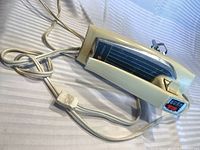 Side and top view of Sunbeam Mixette showing label, ivory housing and attached cord