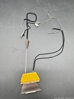 Full view of necklace showing cord, chain, pendant elements