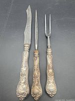 Knife, steel, fork full view