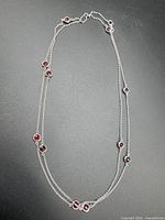 Entire necklace laid out showing length and stone placement