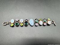 Full view of sterling silver bracelet showing all stones and toggle clasp