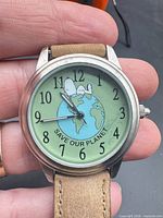 Front view of Peanuts Save Our Planet watch showing dial design and case