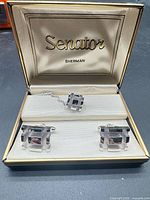 Open Senator Sherman box showing cufflinks and tie tack set