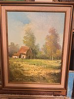 Full view of framed landscape painting