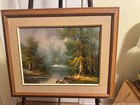 Frontal view of framed landscape oil painting