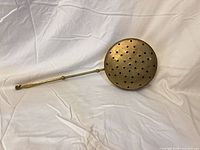 Bed warmer closed showing perforated lid and full handle