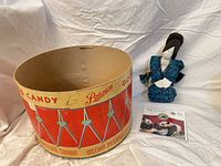 All three items: Paterson candy drum, geisha doll, panda coin