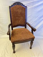 Full view of armchair showing frame, upholstery, legs