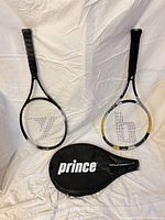 Front view of two rackets and Prince cover on white backdrop