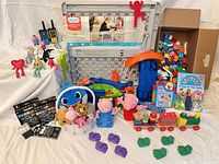 Full lot overview showing gate, toys, blocks, art supplies