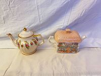 Both teapots side by side showing overall forms and decoration