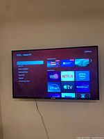 Front view of TCL Roku TV powered on
