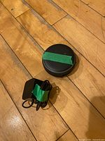 Top view of Amazon Echo Dot next to its power adapter