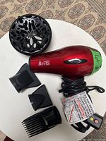 Hair dryer with four attachments displayed