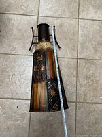 Tall mixed-material vase with measuring tape