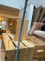 stacked view showing all four pine crates with measuring tape for scale