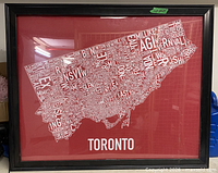 Framed Toronto map poster, red background with white neighbourhood names, black frame