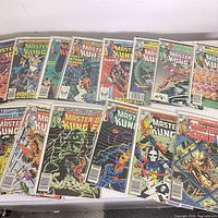 All 15 Master of Kung Fu comics laid out on table
