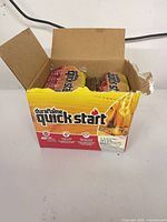 Open cardboard box of Duraflame Quick Start firestarter lighters