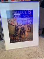 Framed color photograph print in silver frame with white mat