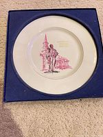 Front of commemorative plate in box