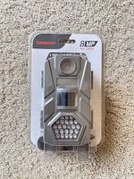 Front view of unopened Tasco 8MP trail camera package