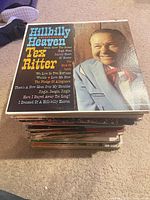 Stack of vinyl LPs, top album Tex Ritter Hillbilly Heaven