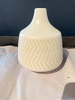 front view of ceramic vase showing chevron pattern
