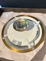 Fixture base with wiring and mounting hardware visible