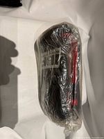 One glove wrapped in original plastic