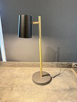 Full view of lamp showing shade, stand, base and cord