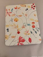 Front view showing floral tri-fold cover