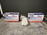 Two sealed RAB boxes and one unboxed fixture