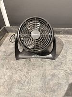 Front view of Sunbeam table fan showing grille and base