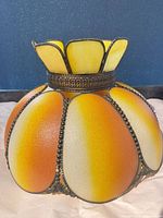 Full view of Tiffany-style amber/orange lamp shade showing overall design and color