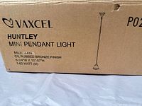 Factory box showing Vaxcel Huntley mini pendant light specifications