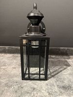 Front view of black lantern wall light
