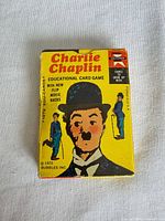 Front of Charlie Chaplin educational card game box showing title, illustration, copyright and brand