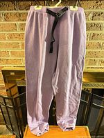 Full front view of lavender jogger pants hanging