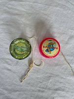 Top view of both yo-yos showing logos and strings