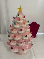 Front view of pink ceramic tree showing bulbs and star