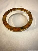 Top view showing clear center and floral gold rim