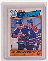 Front of 1983 O-Pee-Chee #23 Gretzky/Messier Oilers highlight card in plastic sleeve