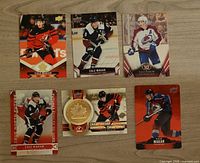 six Cale Makar Upper Deck hockey cards arranged on tabletop