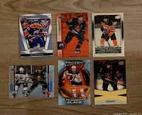 Six Leon Draisaitl Upper Deck hockey cards laid out on tabletop