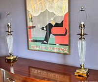 Both matching crystal and bronze table lamps on wooden surface